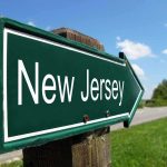 Directional road sign indicating New Jersey