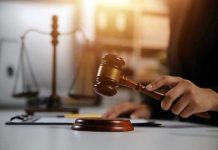 Gavel being struck near scales of justice.