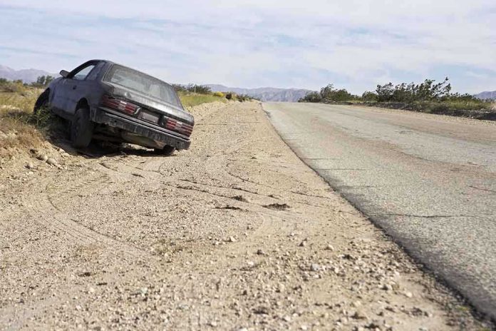 shutterstock_120803002.jpg Abandoned car on the side of a deserted road in a dry landscape