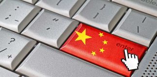 Close-up of a computer keyboards enter key featuring the Chinese flag