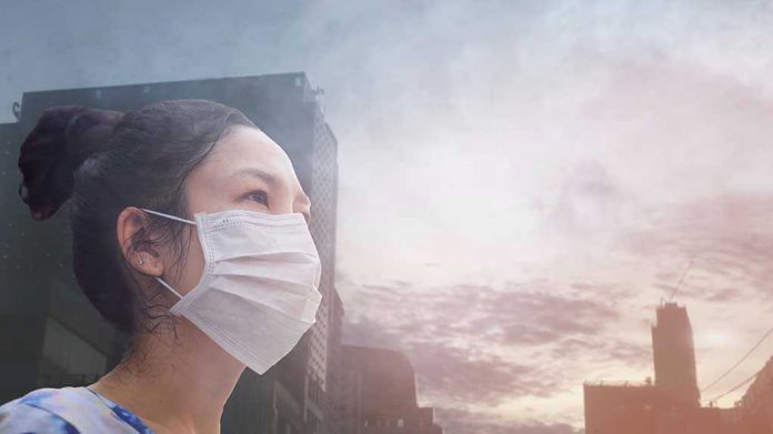 Person wearing a mask in a cityscape background.