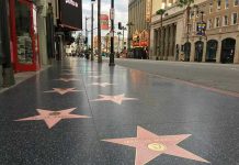 Hollywood Walk of Fame stars on sidewalk.