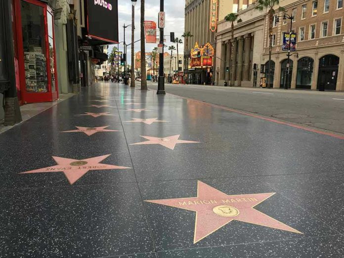 1681128400 Hollywood Walk of Fame stars on sidewalk.