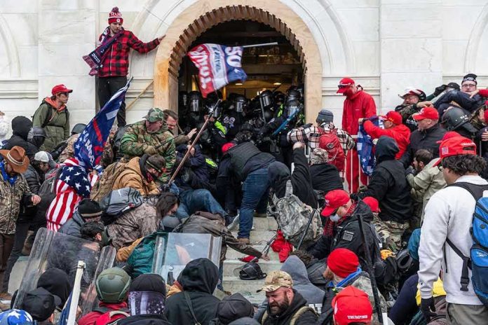1889190778 Crowd storming a building entrance with flags and signs.