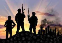 Terrorist Leader Praised as HERO on American Soil Three armed silhouettes near a smoky city skyline.