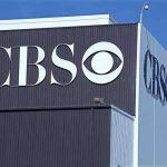 Exterior view of a CBS media building featuring the CBS logo