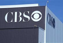 Exterior view of a CBS media building featuring the CBS logo