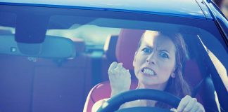 Woman Drives During Court — Her LIE Backfires Angry woman gripping the steering wheel in a car