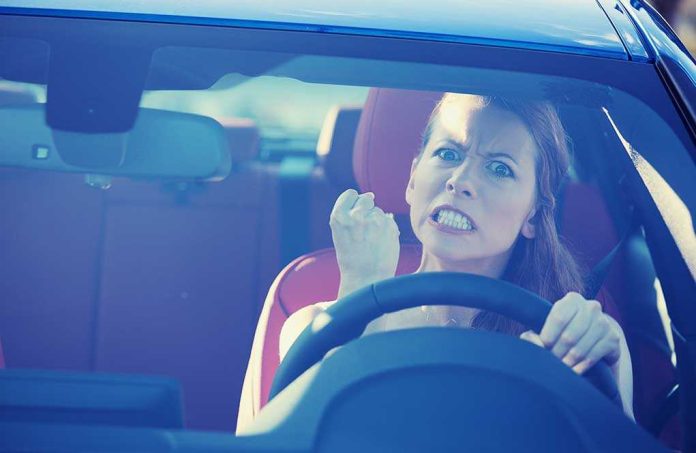 shutterstock_223380148.jpg Angry woman gripping the steering wheel in a car