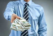 Miami’s NEW Billionaire-ONLY Commute Sparks Outrage Person handing over a stack of money.