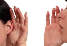 Person whispering into another persons ear gesture