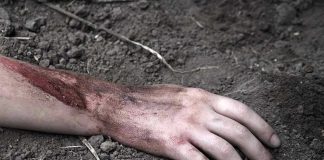 Cartel Death Ranch Keeps Spitting Remains Injured arm partially buried in dirt.