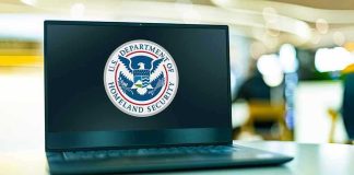 Laptop displaying U.S. Department of Homeland Security logo.