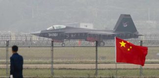 China Caught Red-Handed Fueling Iranian Arsenal Jet with 31001 marking behind barbed wire fence.