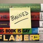 Stack of banned books with a sticky note.