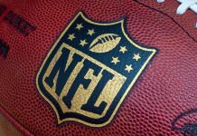 Married NFL Coach CAUGHT in Cheating Scandal Close-up of an NFL football with the logo prominently displayed