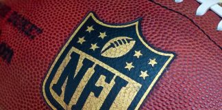 Married NFL Coach CAUGHT in Cheating Scandal Close-up of an NFL football with the logo prominently displayed