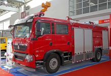 Red fire truck displayed at an exhibition