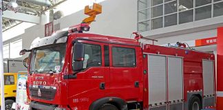 Red fire truck displayed at an exhibition