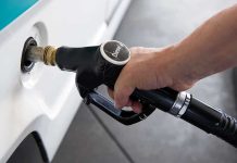 $8 Diesel SHOCK Hits California A hand holding a diesel fuel nozzle while refueling a vehicle