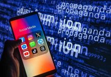 INSULT DEBATE: When Does Rhetoric Turn ‘Violent’? Smartphone showing social media apps with text background.