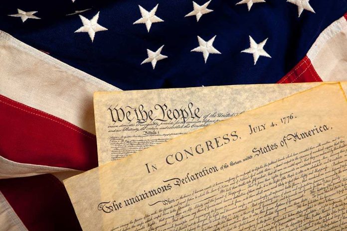 shutterstock_40563325 The Declaration of Independence laid on an American flag