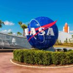 The $264 Million NASA Mistake NASA logo sculpture with spaceship and palm trees.