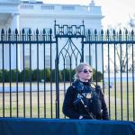 Pentagon Gamble: J6 Hire in Counterterror Ops Secret Service agent stands guard outside the White House.