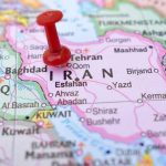 Iran-Linked Gang Sends Teen Hitman Red pushpin marking Iran on a map.