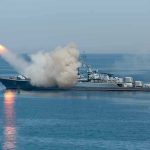 Gulf Shock: Missiles Streak Toward Allies Warship firing missile in the sea.