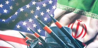 Iran Not Dead–But Definitely Bleeding Profusely Iran and USA flags with missile launcher.