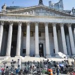 Court Smacks Down Biden On Tapes Courthouse facade with media crews setting up outside.