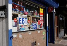 City Supermarkets Trigger Bodega Revolt Convenience store window with EBT and ATM signs