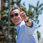 Stunned Parents: Lawmakers Greenlight Child Predators Man giving a thumbs up while wearing sunglasses