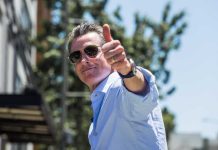 Stunned Parents: Lawmakers Greenlight Child Predators Man giving a thumbs up while wearing sunglasses