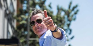 Stunned Parents: Lawmakers Greenlight Child Predators Man giving a thumbs up while wearing sunglasses