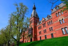 Historic red brick building with tower on a sunny day