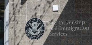 Sanctuary Showdown Erupts — Chaos In Congress Signage for U.S. Citizenship and Immigration Services on a building