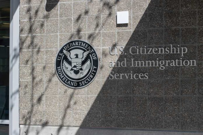 shutterstock_2425825843 Signage for U.S. Citizenship and Immigration Services on a building