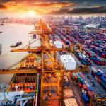 China’s New Export Ban— EU Scrambles Container port with cranes and cargo ships at sunset