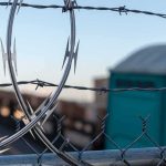 EU Lawmakers Arrive at Border Then Get TURNED AWAY Razor wire on a chain-link fence