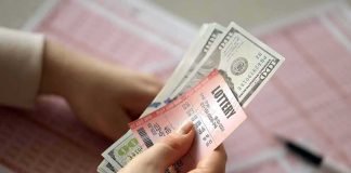 NYC Woman Trades $5K in Jewelry for ‘Winning’ Lottery Ticket Hands holding lottery tickets and U.S. dollar bills
