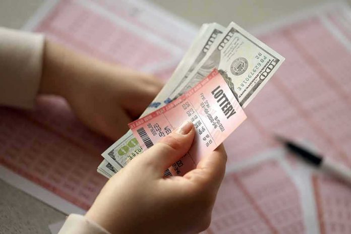 Hands holding lottery tickets and U.S. dollar bills