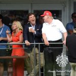 Group of spectators on a balcony at a golf event