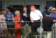 How Tucker’s ‘Third Party’ Plot Could Sink MAGA Group of spectators on a balcony at a golf event
