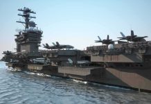 Navy’s Last Super Hornets—But Not Goodbye Aircraft carrier at sea with fighter jets on deck