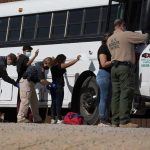 Teacher Says Violent Criminals Shouldn’t Be Deported Border patrol officers investigating people near a bus.