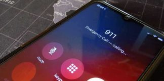 Phone screen showing 911 emergency call in progress.