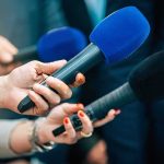 Iran Threat Triggered Wild Air Force One Deception in Turkey Reporters holding colorful microphones