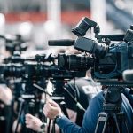 Royal Navy Drones Found Using Cameras Linked to China Broadcast cameras on tripods at a press event